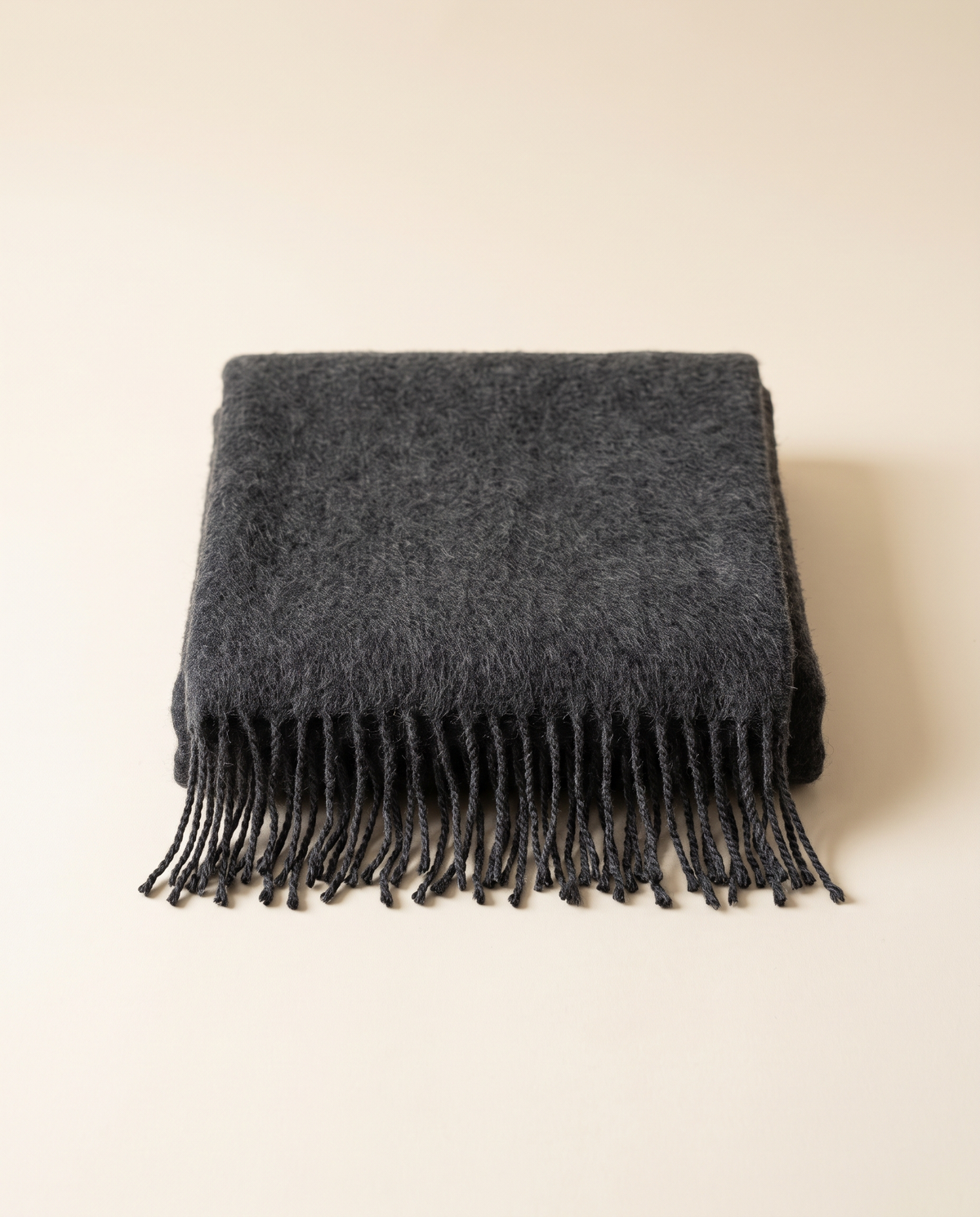 Folded baby alpaca throw in dark gray