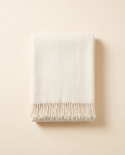 Folded baby alpaca throw in white