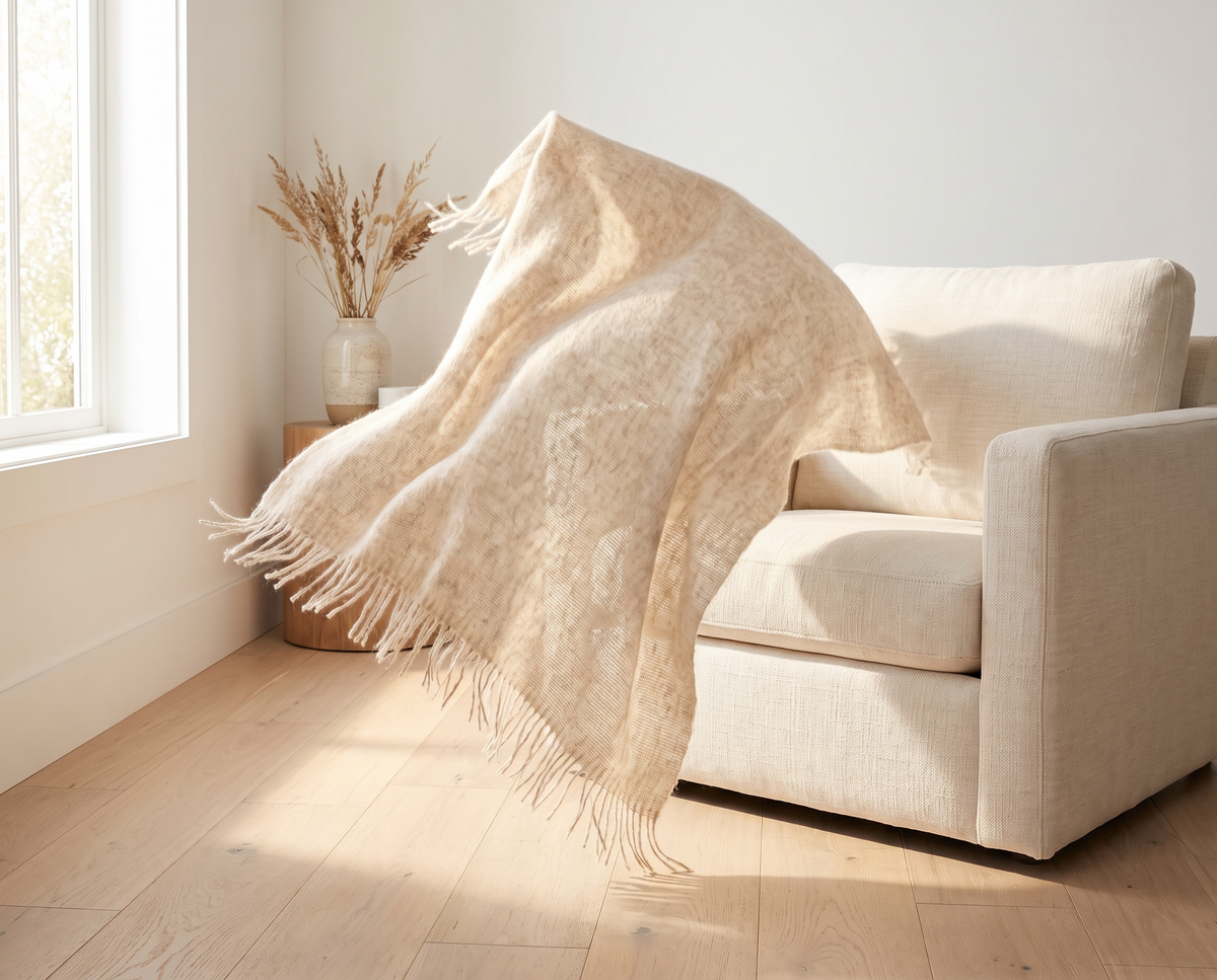 Lightweight throw falling off an armchair (concept image)
